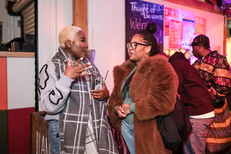 An attendee meets another guest.