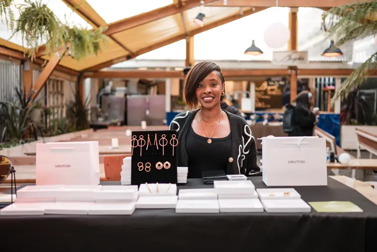 A founder at her exhibition table.