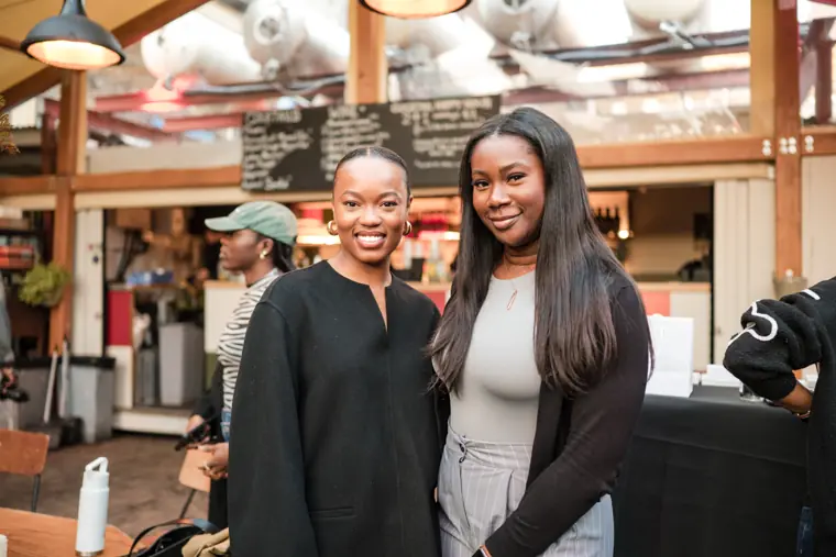 Two founders share a portrait in the venue.