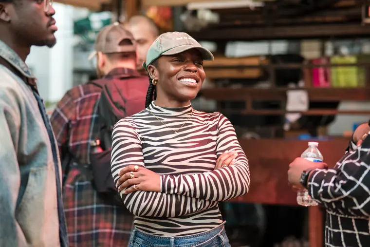 A guest smiles during a networking conversation.