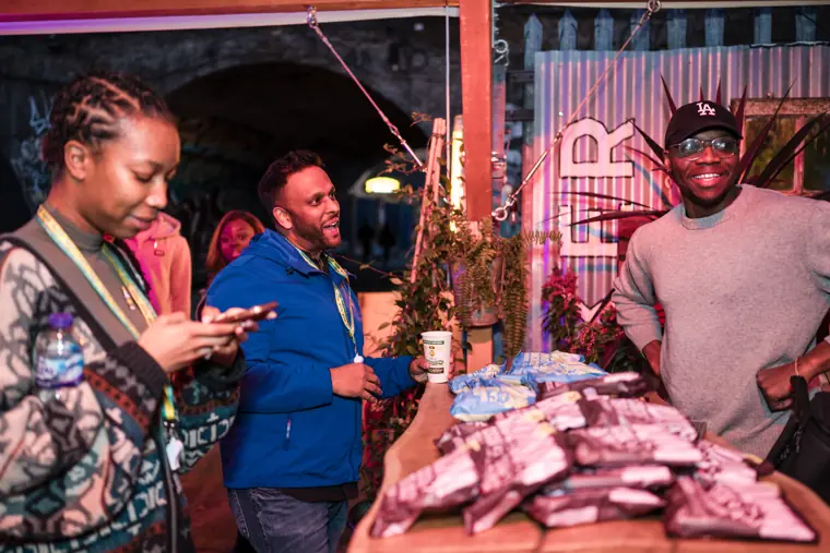 A group explores a product display.
