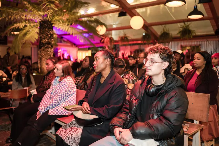 Guests listen to the panel discussion.