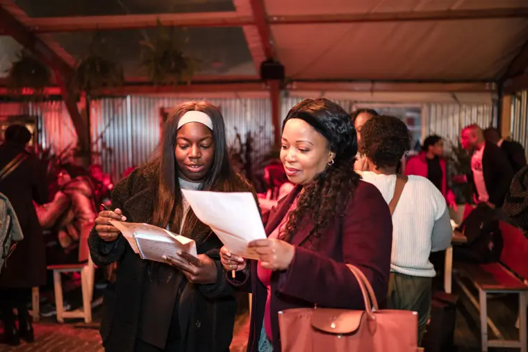 Guests read the mixer programme.
