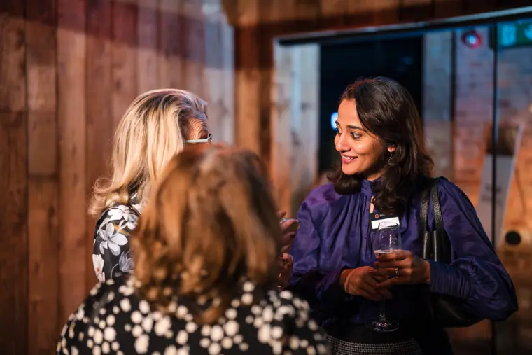 Two guests meet at the event.