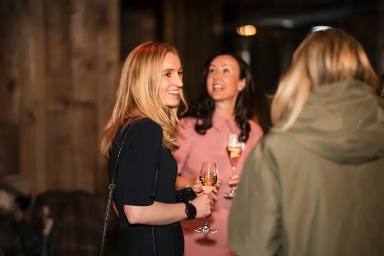 Attendees talk at the drinks reception.