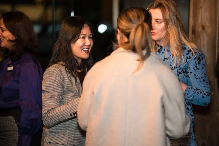 Guests share a relaxed conversation.