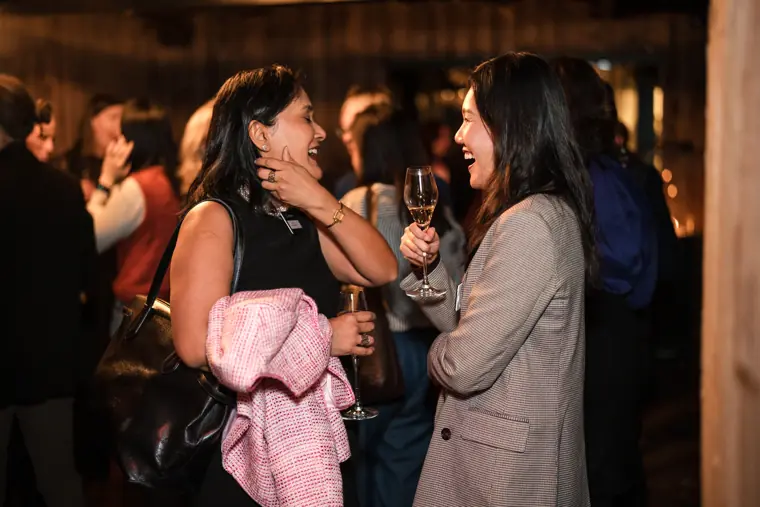 Attendees share a lively conversation.