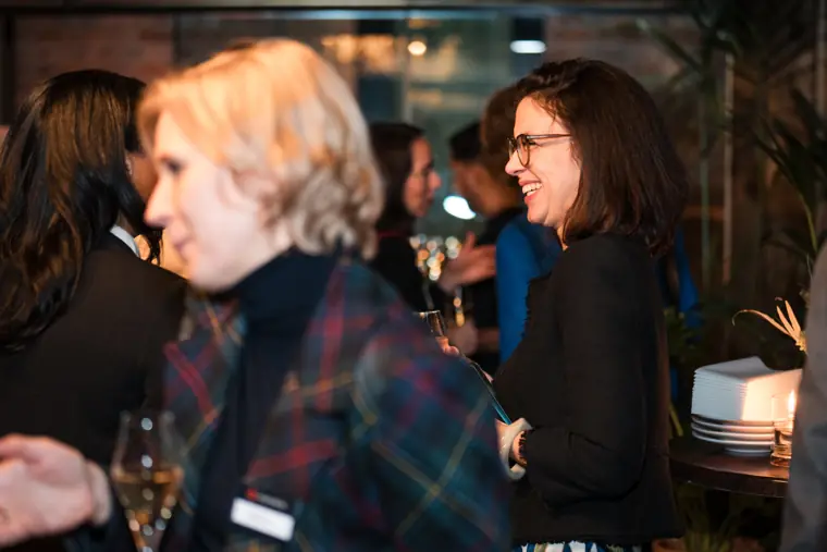 A guest joins friends at the reception.