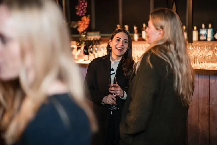 Two attendees exchange views during the event.