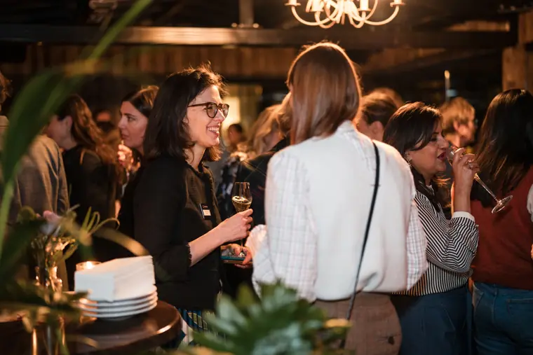 A group of guests connects over drinks.