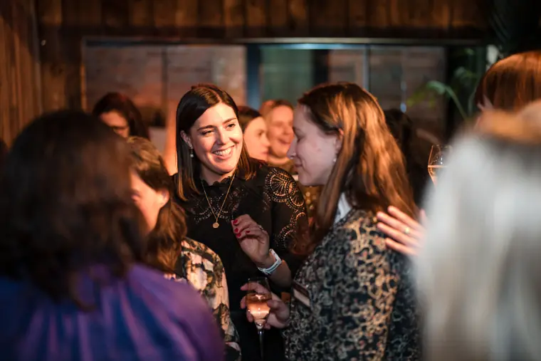 A group reconnects near the drinks area.