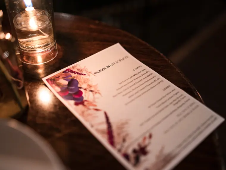 A printed programme on a reception table.