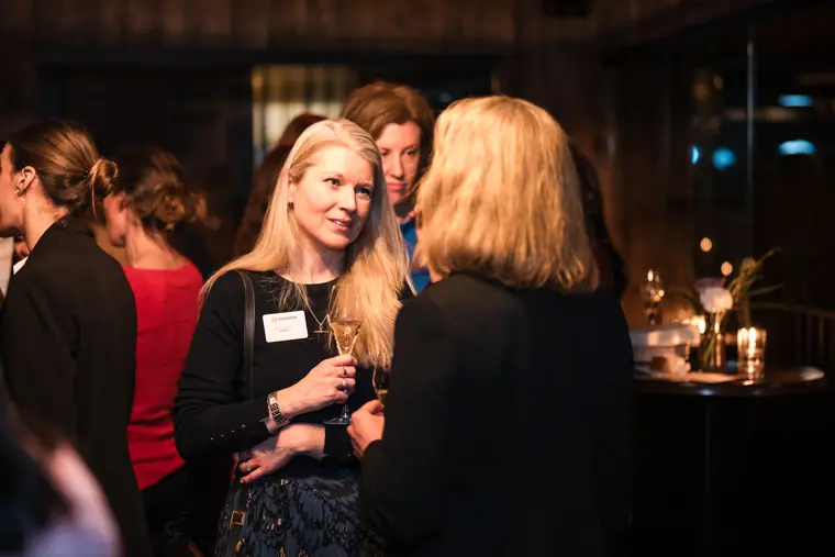 A guest greets another attendee.