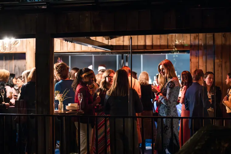 Guests gather beside the terrace window.