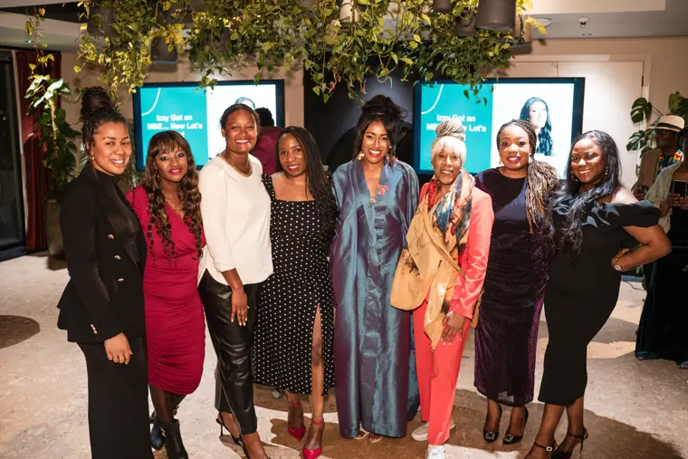 Izzy Obeng celebrating her MBE with guests.