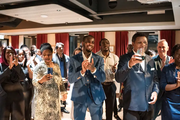 Group portrait at Izzy Obeng’s MBE celebration.