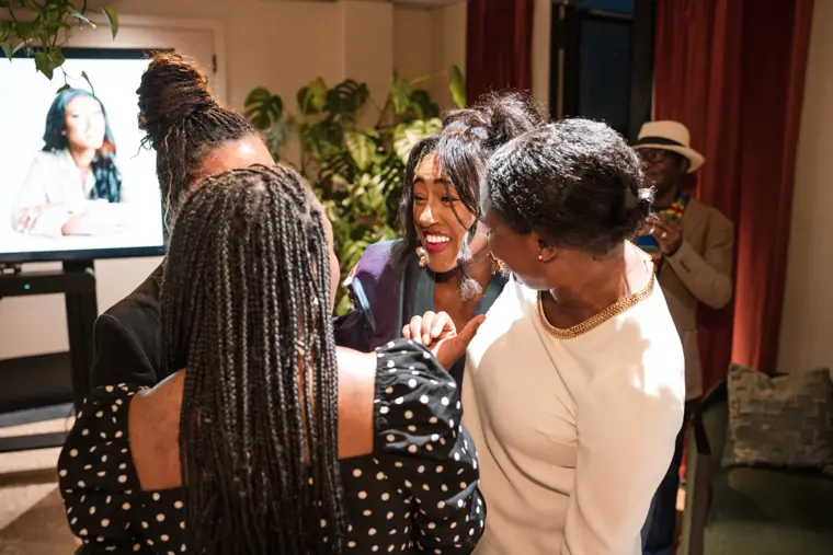 Izzy Obeng with guests at the celebration.