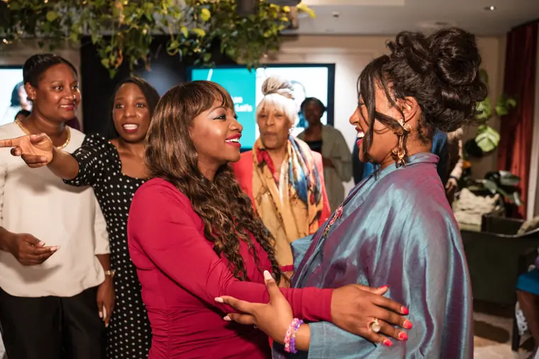 Group portrait at Izzy Obeng’s MBE celebration.