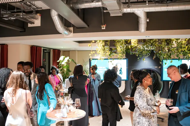Guests connecting at Izzy Obeng’s MBE celebration.