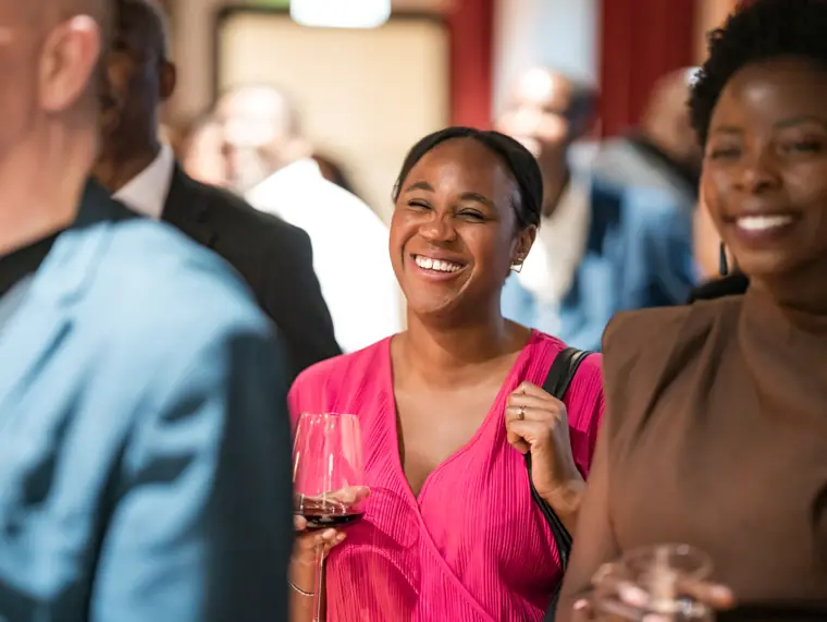 Guests connecting at Izzy Obeng’s MBE celebration.