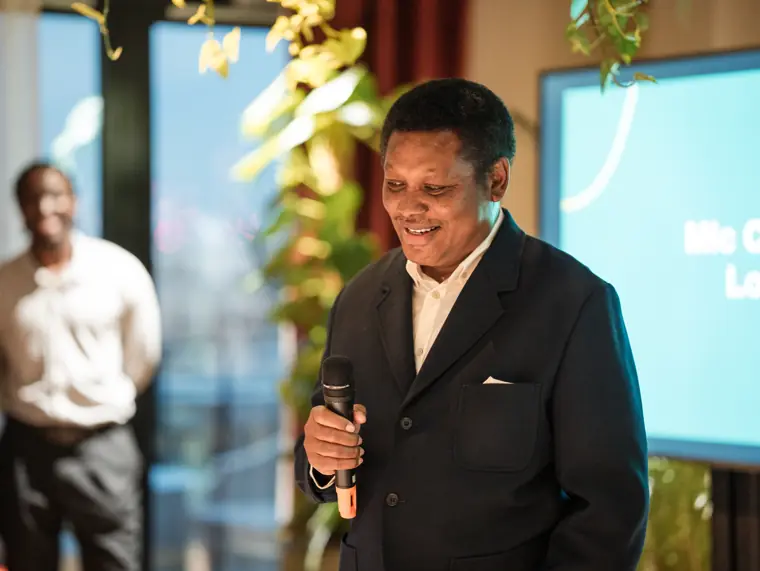 Guest sharing remarks with attendees.