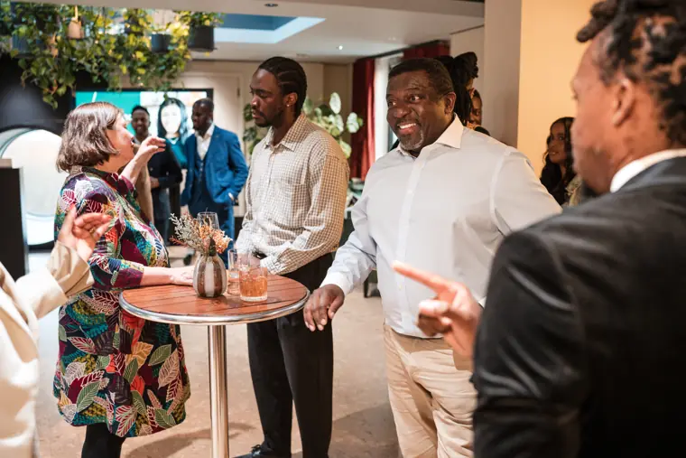 Guests connecting at Izzy Obeng’s MBE celebration.