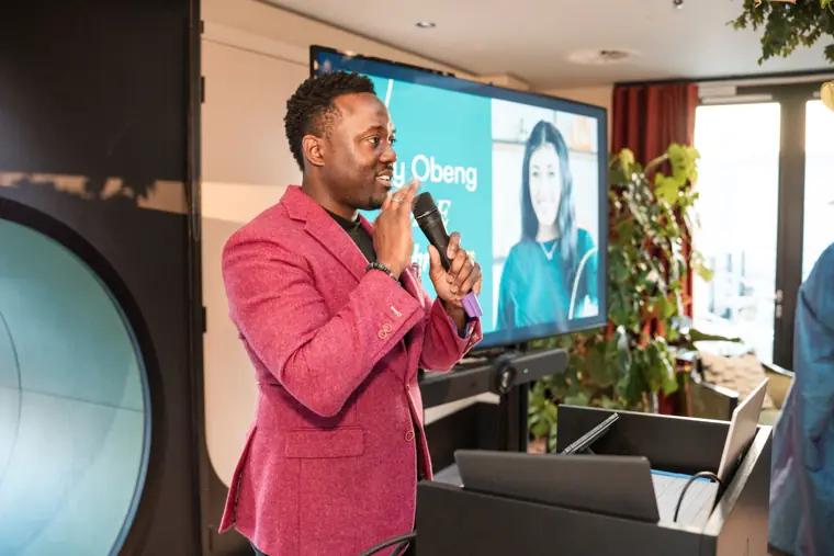 Host speaking at the celebration.