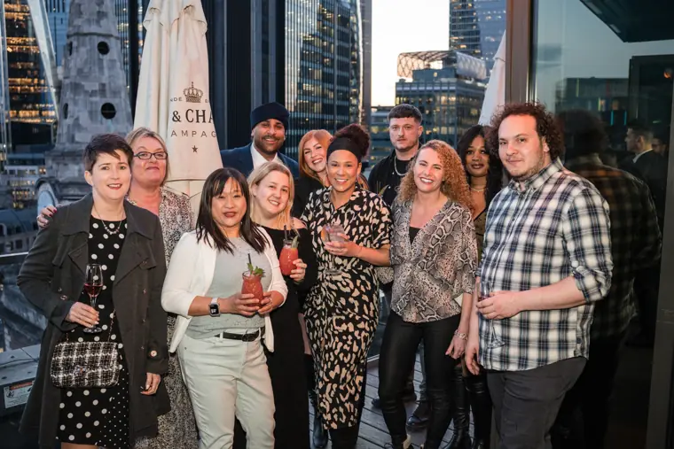 MaMedica team members posing together on the rooftop terrace.