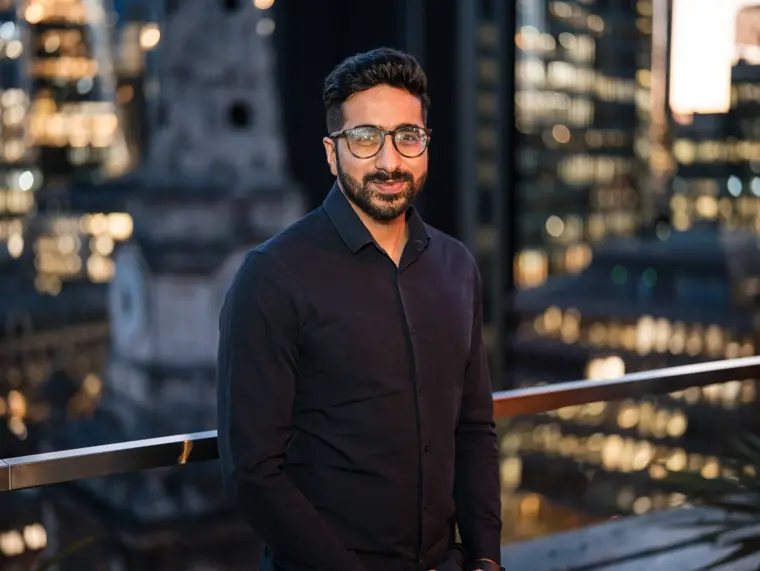 Portrait of a team member against the night skyline.