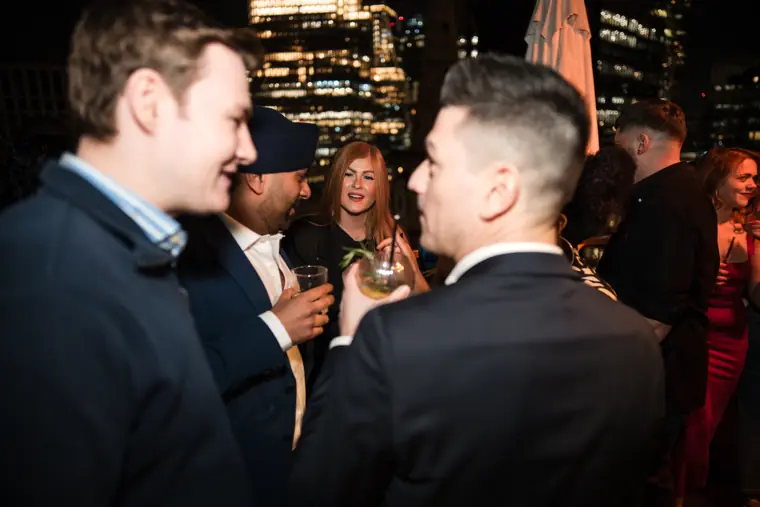 Two men in conversation during the gathering.