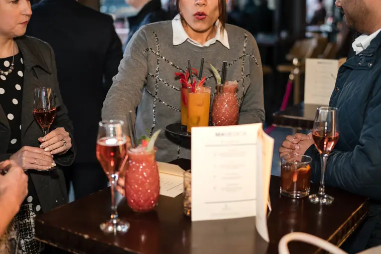 Cocktails and event drinks arranged on a table.