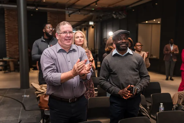 Guests applauding during the showcase.