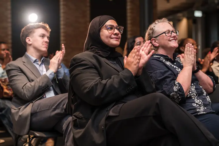 Guests applauding during the showcase.