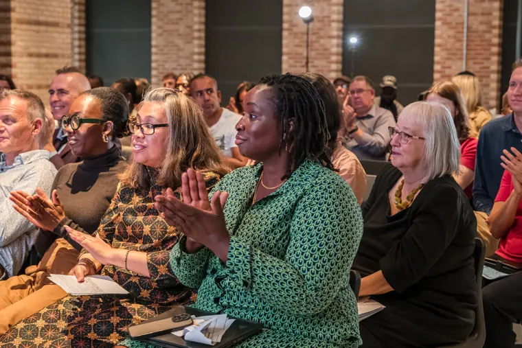 Guests applauding during the showcase.