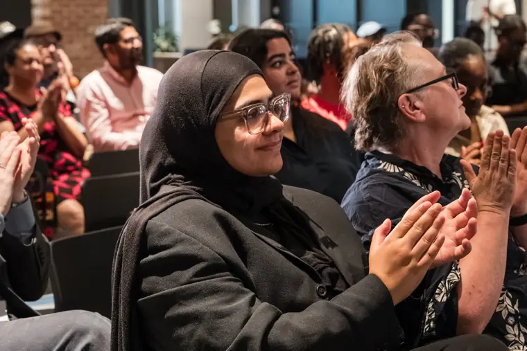 Guests applauding during the showcase.