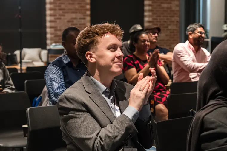 Guests applauding during the showcase.