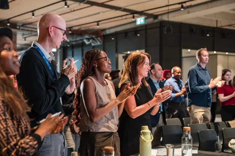 Guests applauding during the showcase.