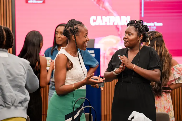 Participants talk after a session.