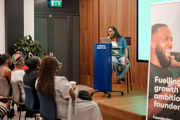 A presenter addresses the founder audience.