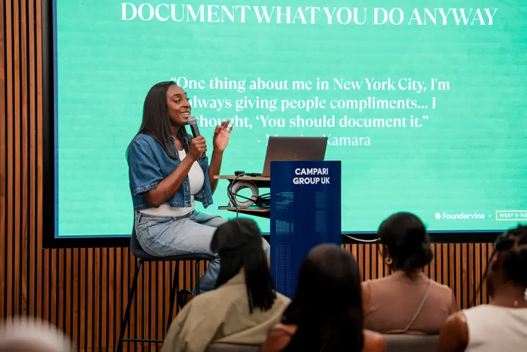 A presenter addresses the founder audience.