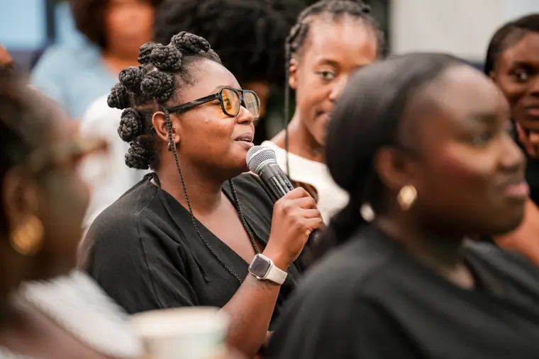 A guest responds during the business workshop.