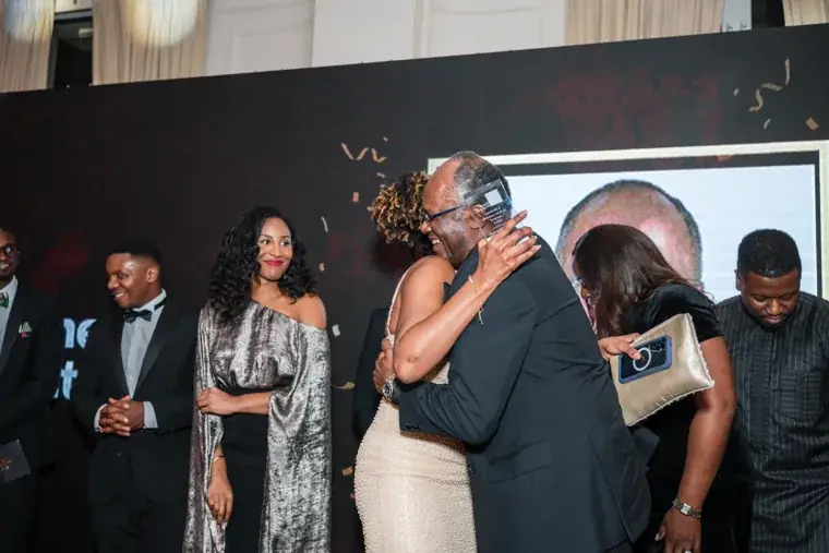 Award recipient hugging a presenter after the announcement at the Black Pharma fifth anniversary gala.