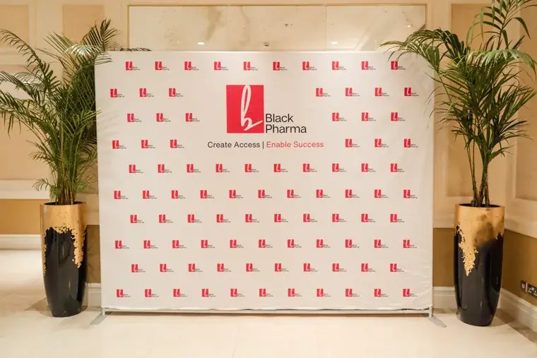 Black Pharma step-and-repeat photo wall set for guest portraits at the Black Pharma fifth anniversary gala.