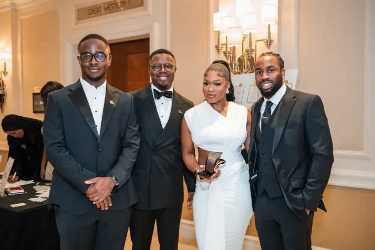 Four guests posing together at the reception at the Black Pharma fifth anniversary gala.
