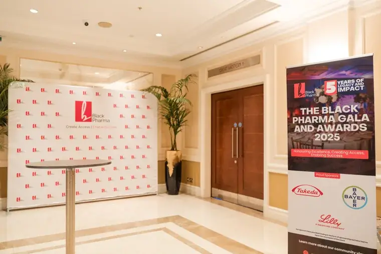 Foyer entrance with the gala sign and branded photo wall at the Black Pharma fifth anniversary gala.