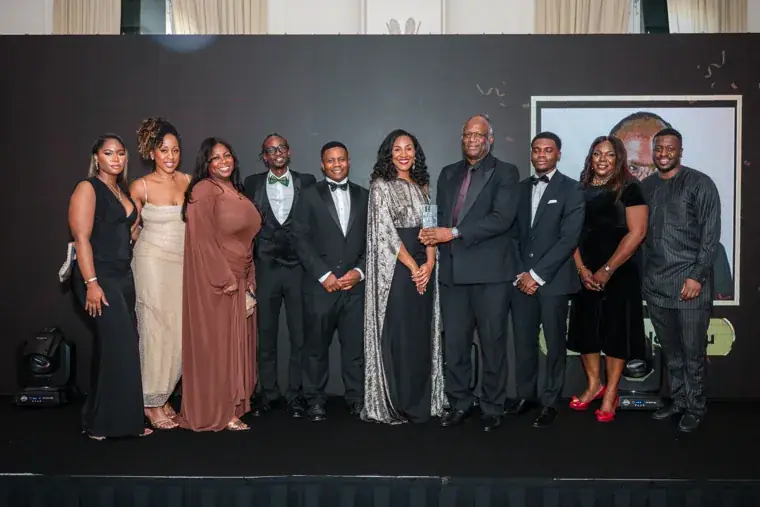 Group of award winners and presenters posing on stage at the Black Pharma fifth anniversary gala.