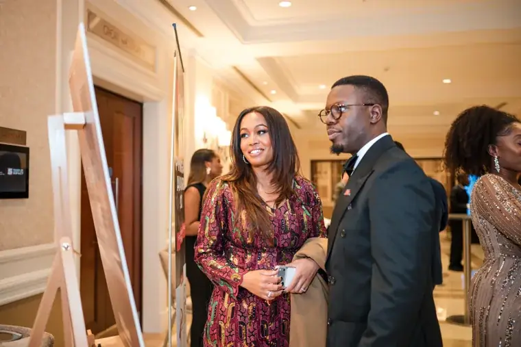 Guest chatting with two attendees during the reception at the Black Pharma fifth anniversary gala.