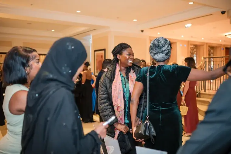 Guest taking a group selfie during the reception at the Black Pharma fifth anniversary gala.