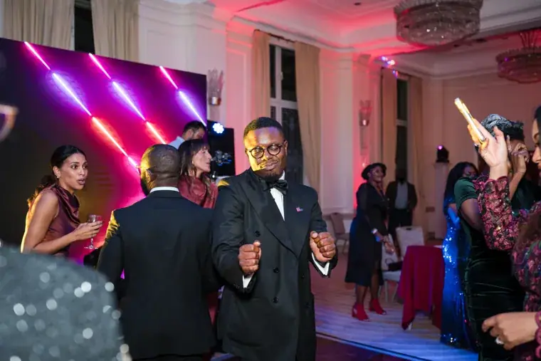 Guests dancing under coloured lights after the awards at the Black Pharma fifth anniversary gala.