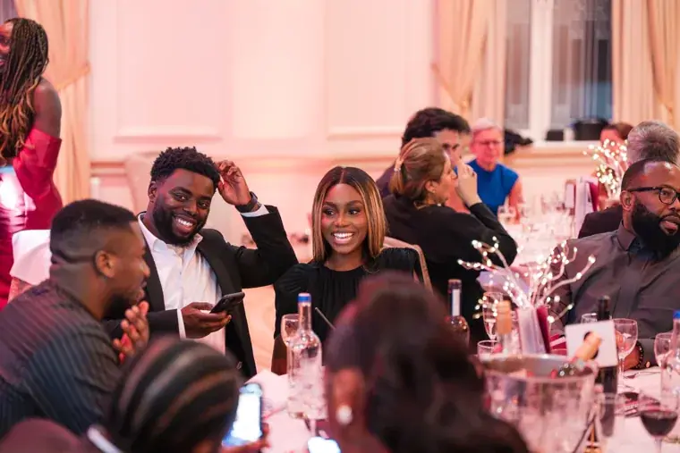 Guests gathered around their dinner table at the Black Pharma fifth anniversary gala.